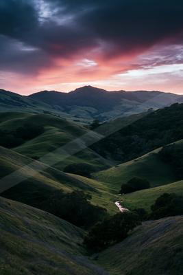 A serene landscape of valley, field.