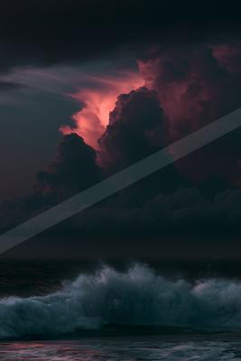 A dramatic water scene of ocean, storm, clouds.