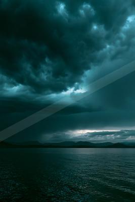A blue hour sky scene of storm, clouds.