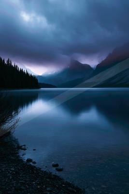 A blue hour long exposure water scene of lake, reflection.