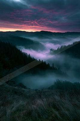 A blue hour landscape of valley, sunrise, mountains.