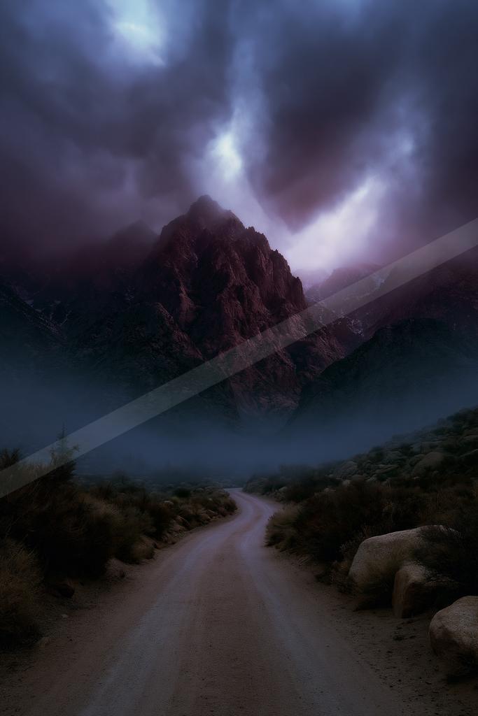 A dramatic sky scene of storm, mountains, valley.