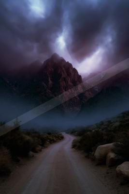 A dramatic sky scene of storm, mountains, valley.