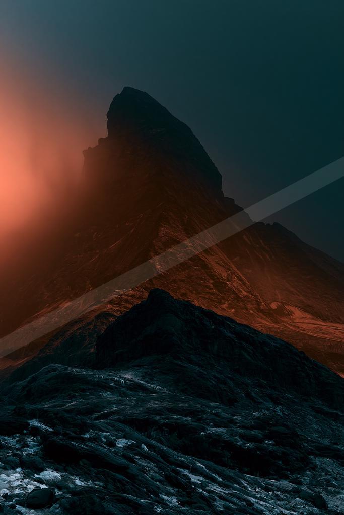 A dramatic landscape of mountains, rocks.