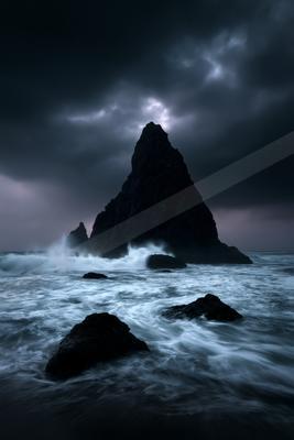 A night water scene of ocean.