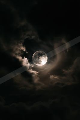 A black-and-white night sky scene of clouds.