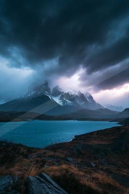 A dramatic long exposure sky scene of storm, mountains.