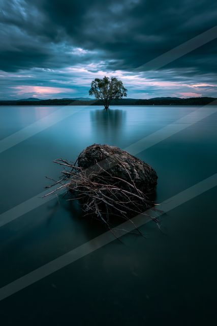 A blue hour long exposure water scene of a lake, reflection.