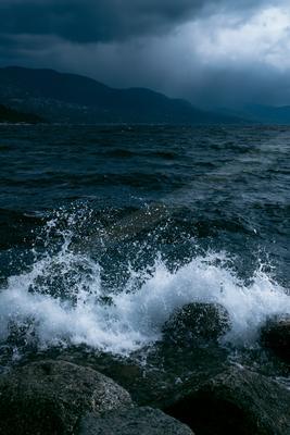A dramatic long exposure water scene of ocean, rocks.