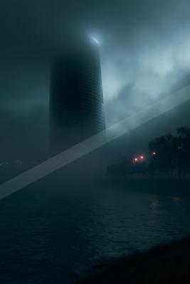 A black-toned moody photograph of beacon, submarine, lakeside.