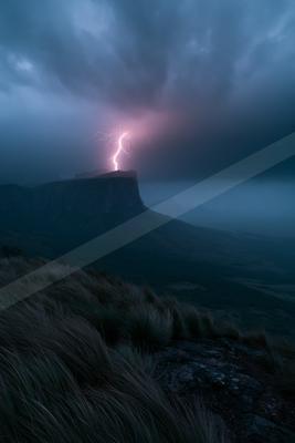 A black-toned moody photograph of volcano, beacon, promontory.