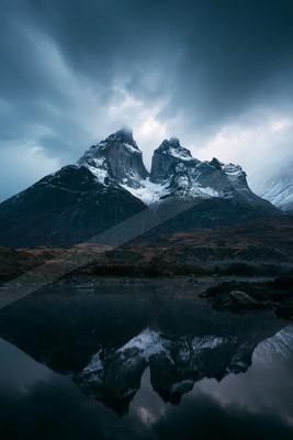 A moody landscape of mountains.