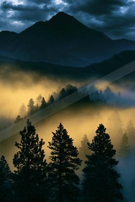A night landscape of mountains, sunrise, valley.