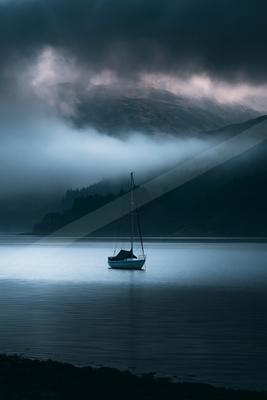 A black-toned moody photograph of catamaran, seashore, lakeside.
