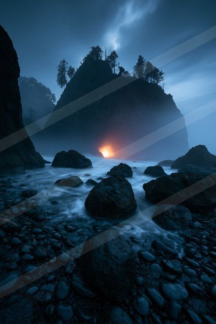 A blue hour long exposure landscape of a volcano, fire.