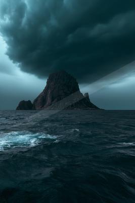 A moody sky scene of storm, ocean.