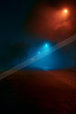 A black-toned moody photograph of spotlight, volcano, stage.