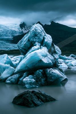 A dramatic high contrast landscape of a glacier, ice.