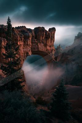 A night architecture photo of bridge, valley, mountains.