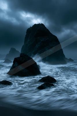 A night long exposure water scene of ocean, storm, fog.