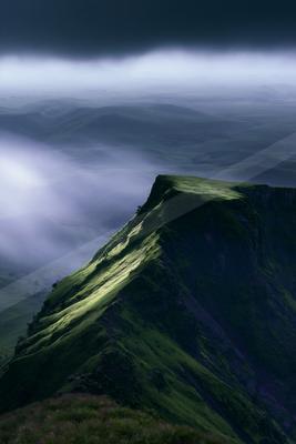 A moody landscape of mountains.