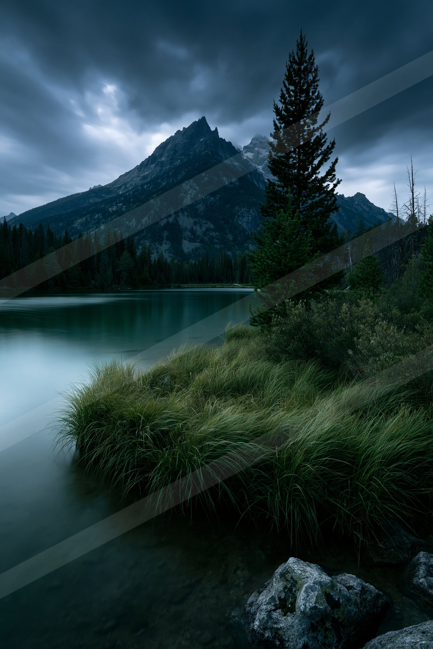 A blue hour long exposure water scene of a lake, reflection.