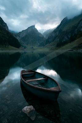 A serene long exposure water scene of lake, reflection.