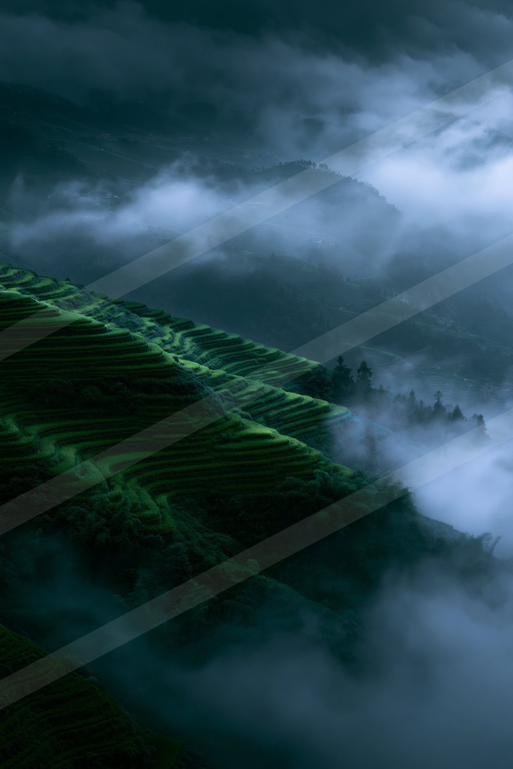 A mysterious high contrast landscape of a rolling hills, fog.