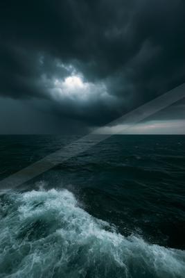 A dramatic sky scene of storm, ocean.