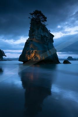 A blue hour long exposure water scene of ocean, sunset, beach.