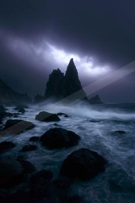 A night long exposure water scene of ocean, storm, fog.