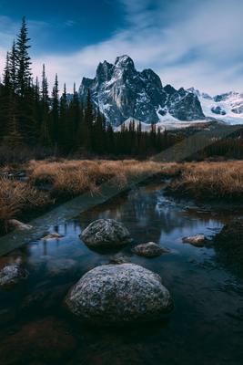 A blue hour long exposure landscape of a mountains, rocks.