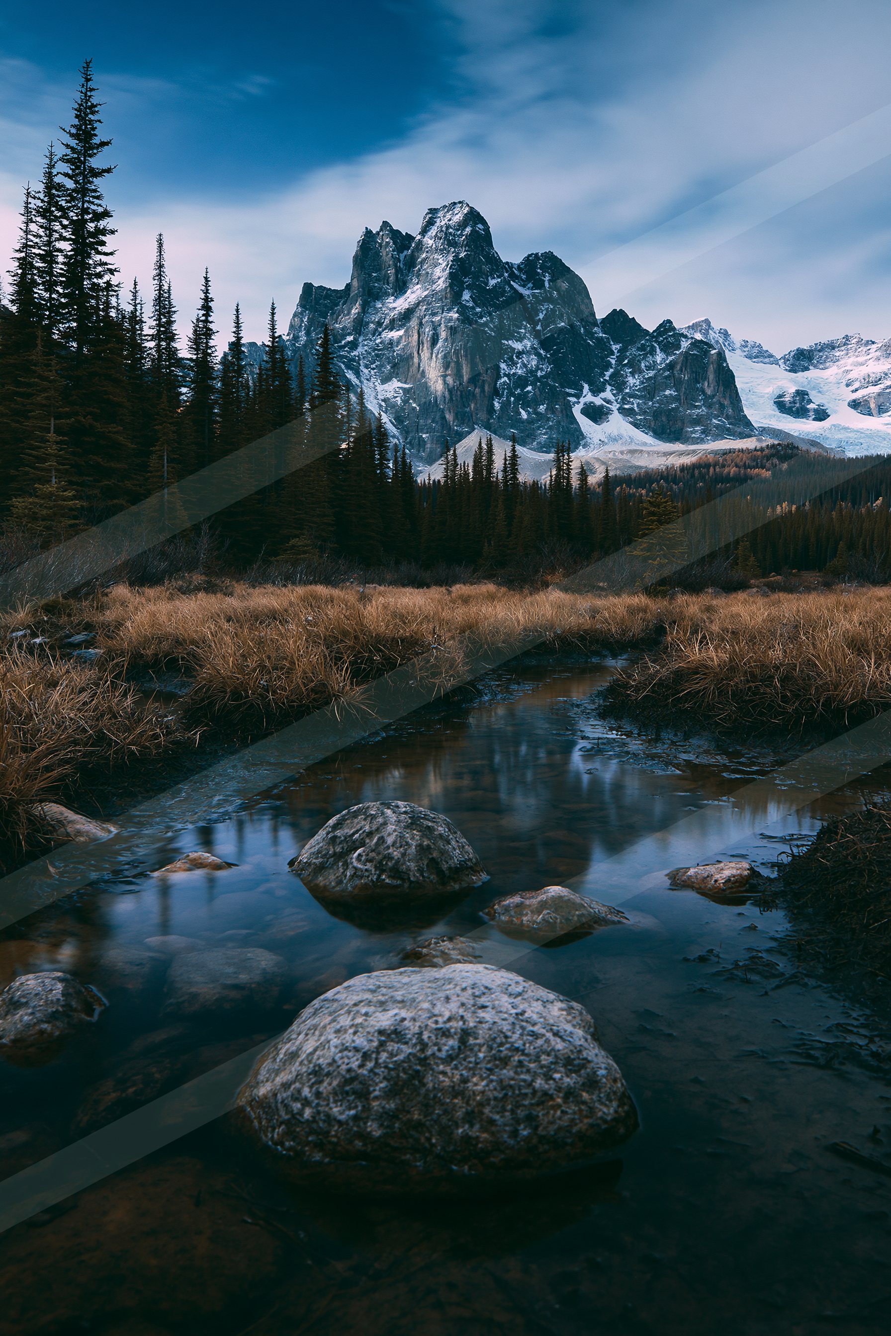 A blue hour long exposure landscape of a mountains, rocks.
