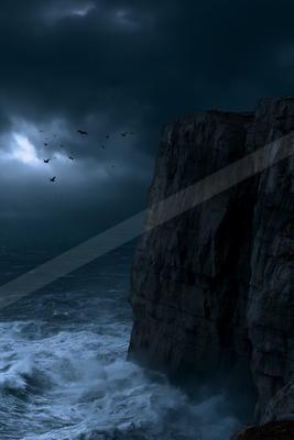 A moody sky scene of storm, ocean.
