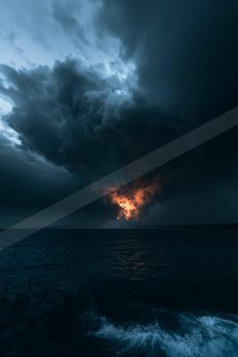Massive dark storm clouds with an orange glowing base hover over a choppy dark ocean under a moody sky.
