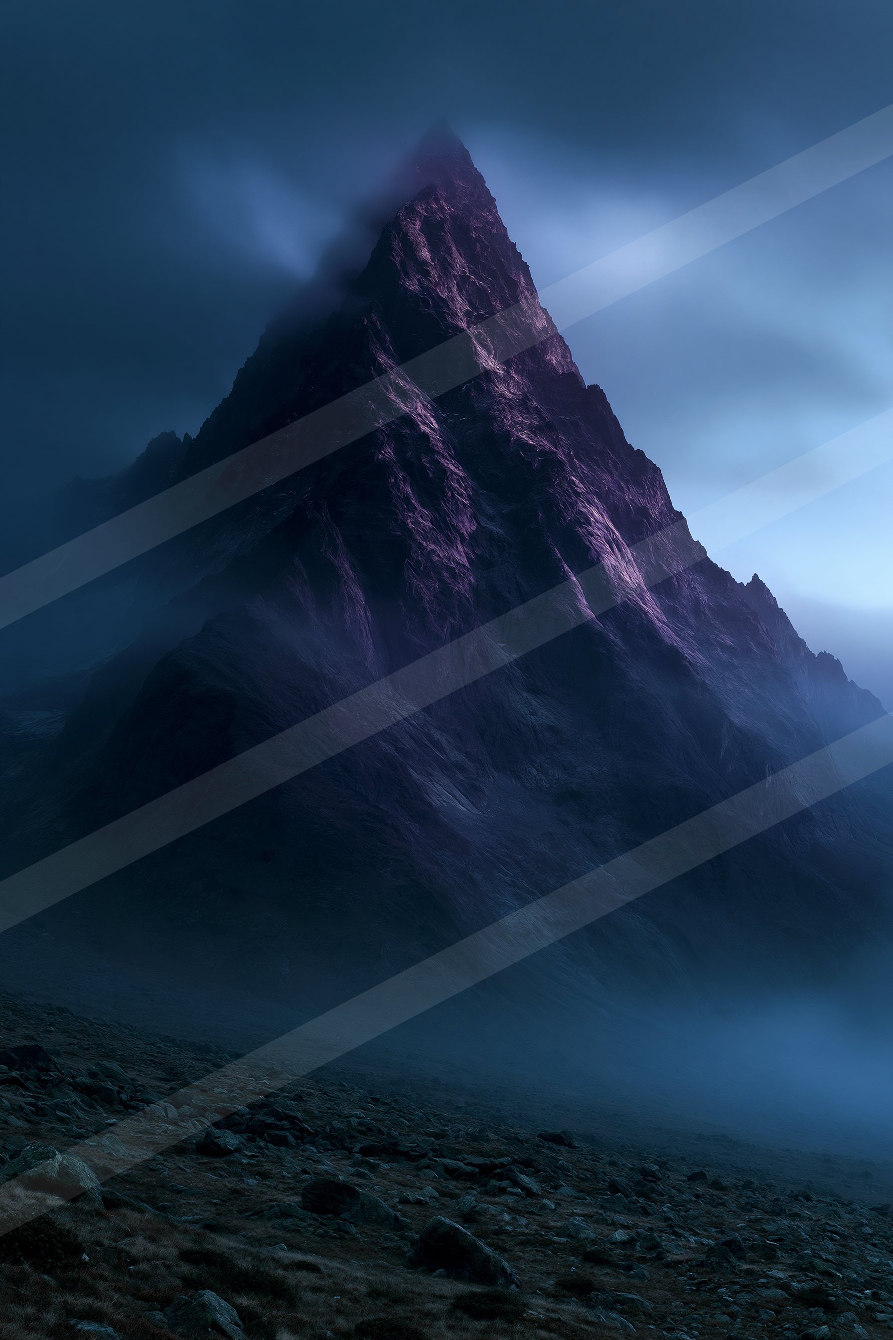 An ethereal landscape of a mountains, fog.
