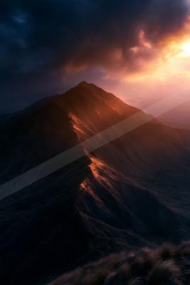 A moody landscape of mountains.