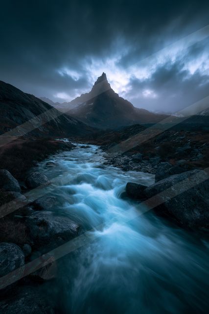 A blue hour long exposure water scene of a stream, ripples.