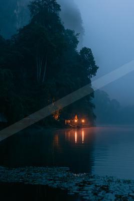 A night long exposure water scene of lake, fog.