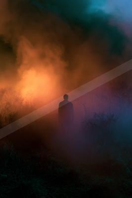 A black-toned moody photograph of volcano, beacon, geyser.