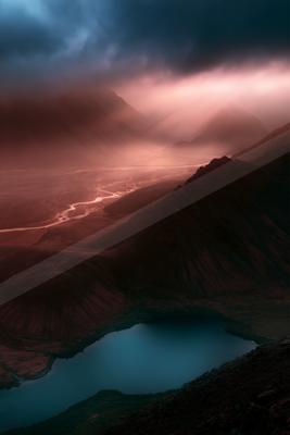 An ethereal panorama landscape of a volcano, fog.