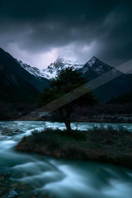 A night long exposure water scene of river, trees, valley.