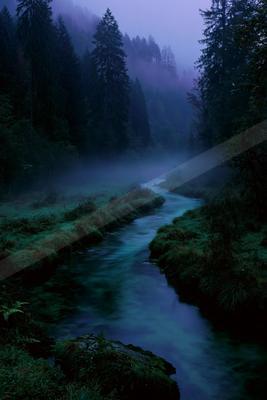 A blue hour water scene of river, fog.
