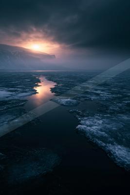 A night water scene of ocean, sunrise, sunset.