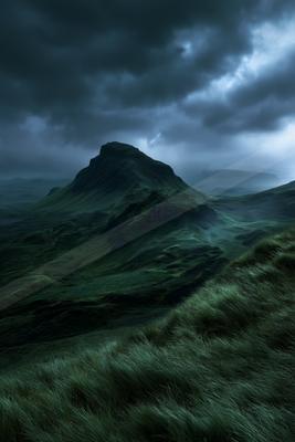 A dramatic sky scene of storm, mountains, valley.
