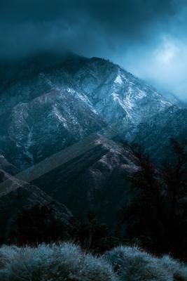 A night landscape of mountains, storm, valley.