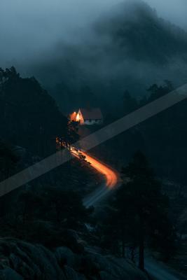 A night long exposure landscape of mountains, road.