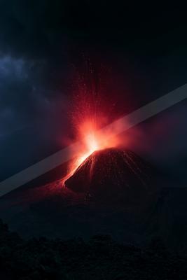 A powerful volcanic eruption at night, with bright red lava exploding from the crater and flowing down the mountainside, illuminating the dark sky with sparks a