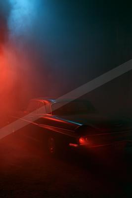 A night long exposure still life of vehicle, fog.