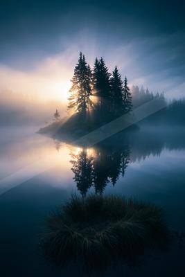 An ethereal double exposure water scene of a lake, reflection.